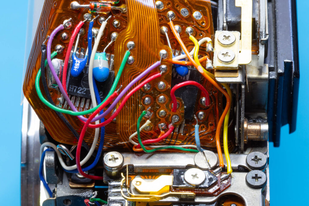 Canon A-1: Removal of mirror box - Four wires desoldered from main flexible board