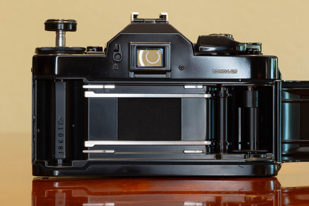 Back of Canon A-1 SLR film camera from the late 1970s, made in Japan, with back cover opened.