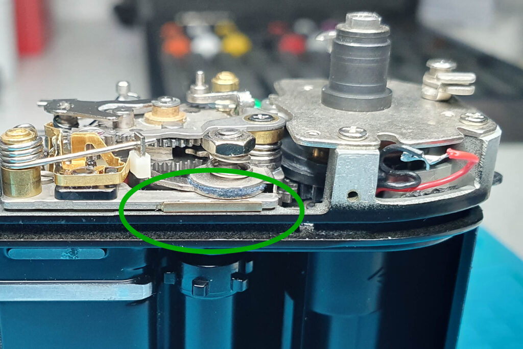 Canon A-1: Mystery Part - Position of the tiny copper spacer (between camera chassis and shutter assembly)