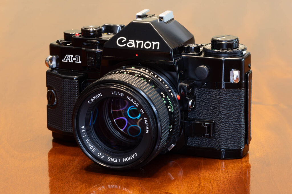 Front of Canon A-1 SLR film camera from the late 1970s, made in Japan. Lens is a Canon FD 50mm f1.4.