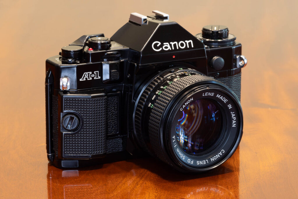 Front of Canon A-1 SLR film camera from the late 1970s, made in Japan. Lens is a Canon FD 50mm f1.4.