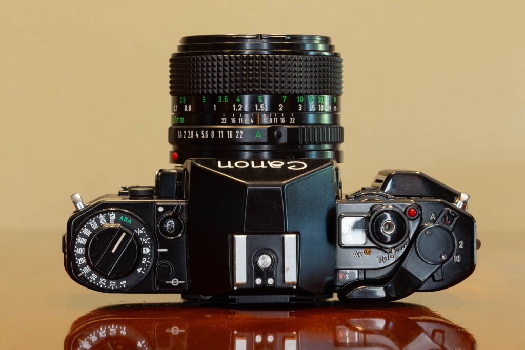 Top of Canon A-1 SLR film camera from the late 1970s, made in Japan. Lens is a Canon FD 50mm f1.4.