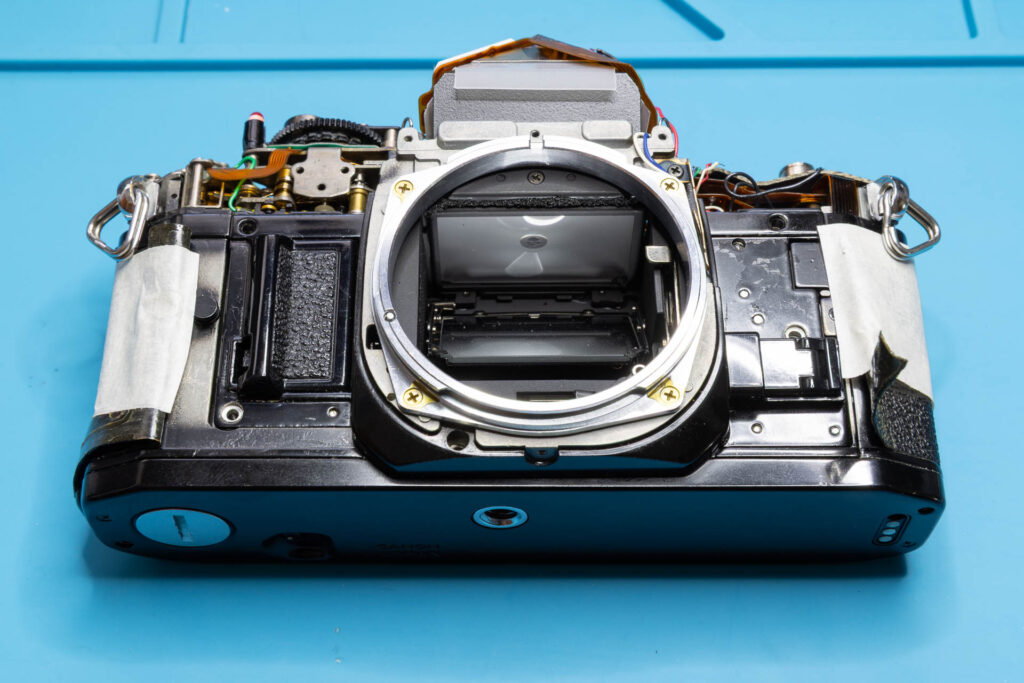 Canon A-1: Removal of mirror box - All five screws of mirror box removed