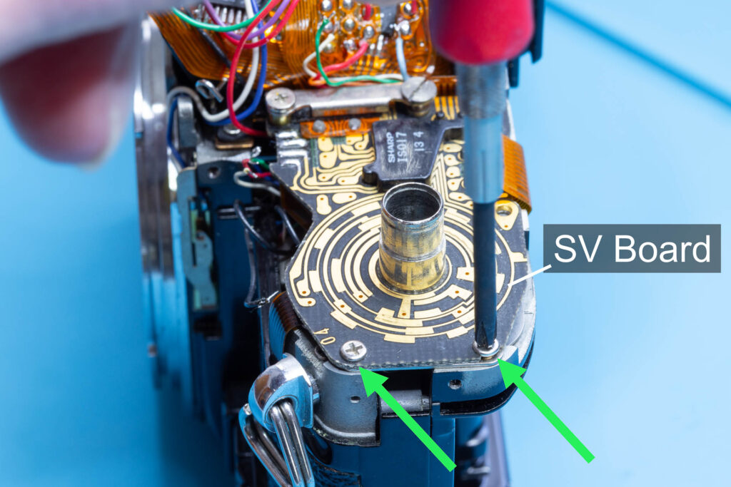 Canon A-1: Removal of mirror box - Remove the two screws holding the SV circuit board