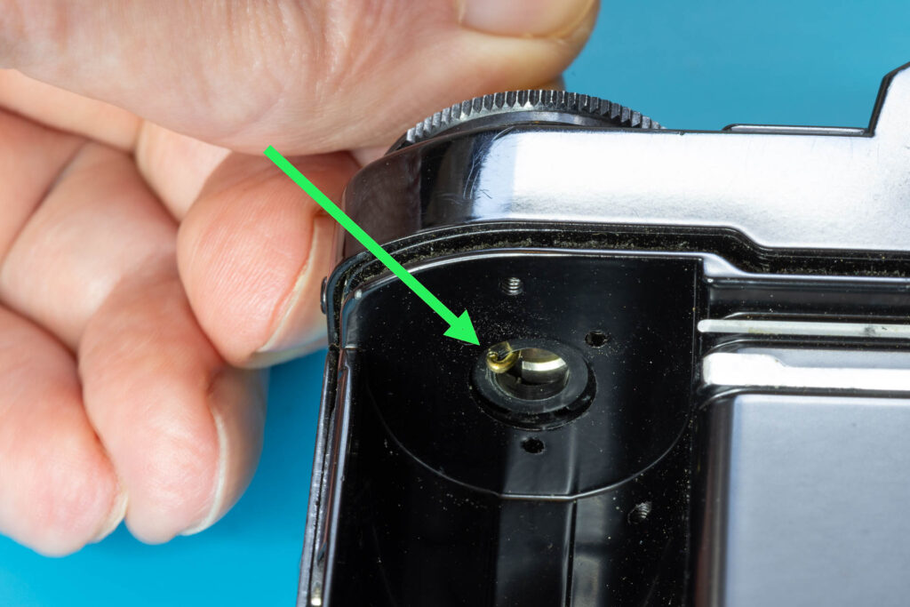 Canon A-1: How to Open the Back Cover - Pull up the paper clip by about 2mm