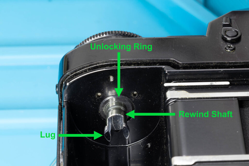Canon A-1: How to Open the Back Cover - Rewind knob/shaft in its resting position, the back cover is locked