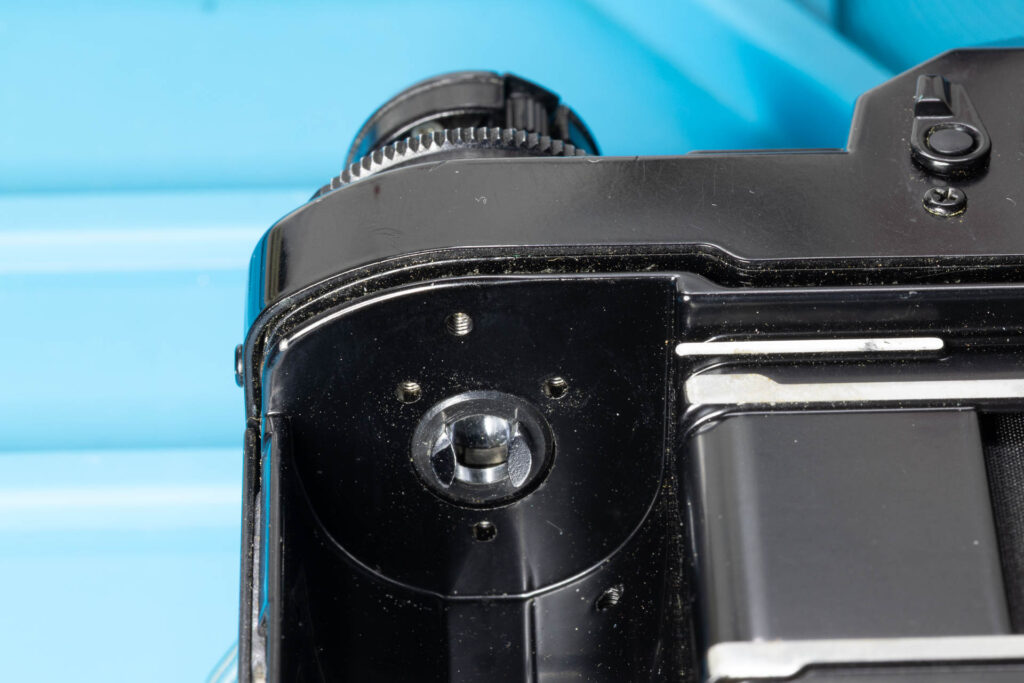 Canon A-1: How to Open the Back Cover - Rewind knob/shaft in its upper position, the back cover is still locked