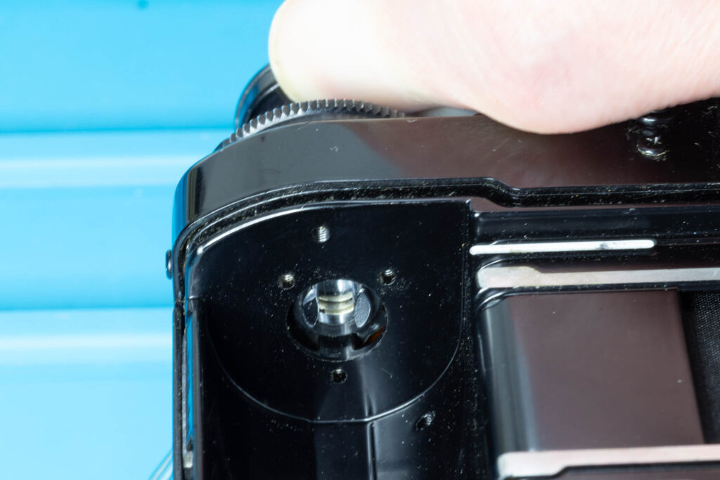 Canon A-1: How to Open the Back Cover - Rewind knob/shaft in its 'Unlock' position, the back cover is unlocked