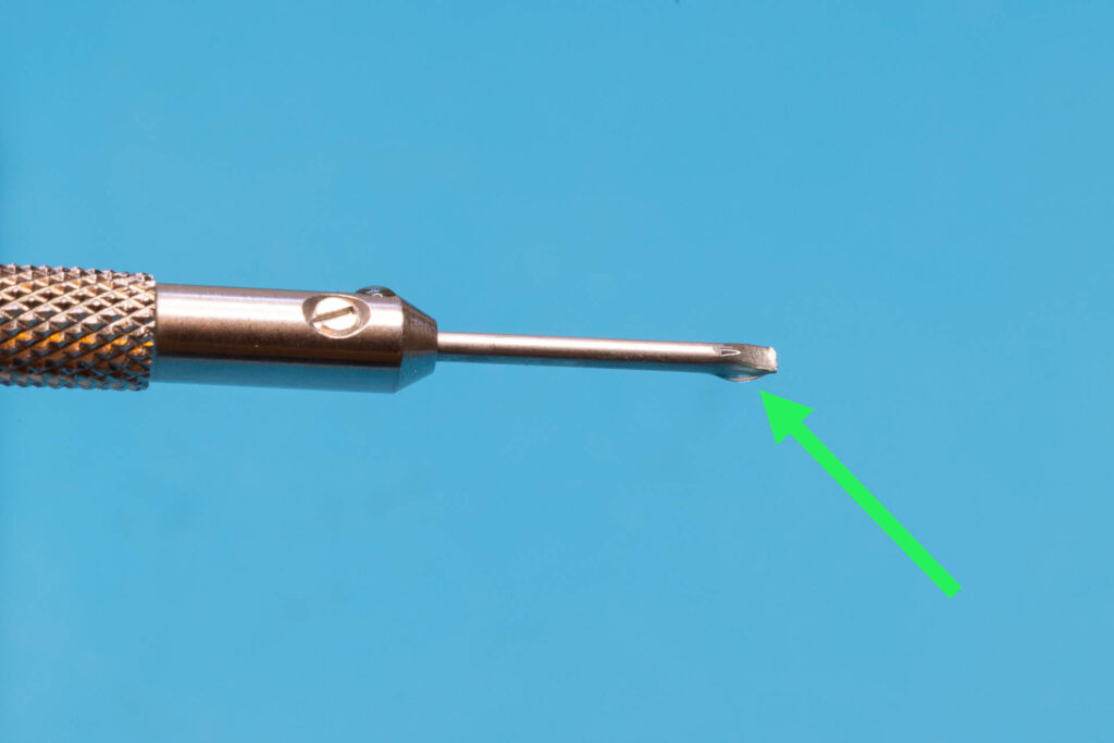 Canon A-1: This drop of oil might be sufficient to fix the "Canon cough" (width of screwdriver blade is 1.2mm)
