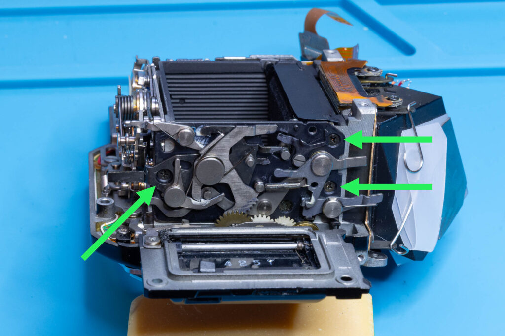 Canon A-1: Remove three screws to remove the mirror-control unit