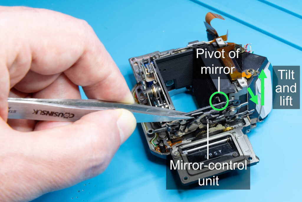 Canon A-1: Tilt and lift the mirror-control unit to remove it