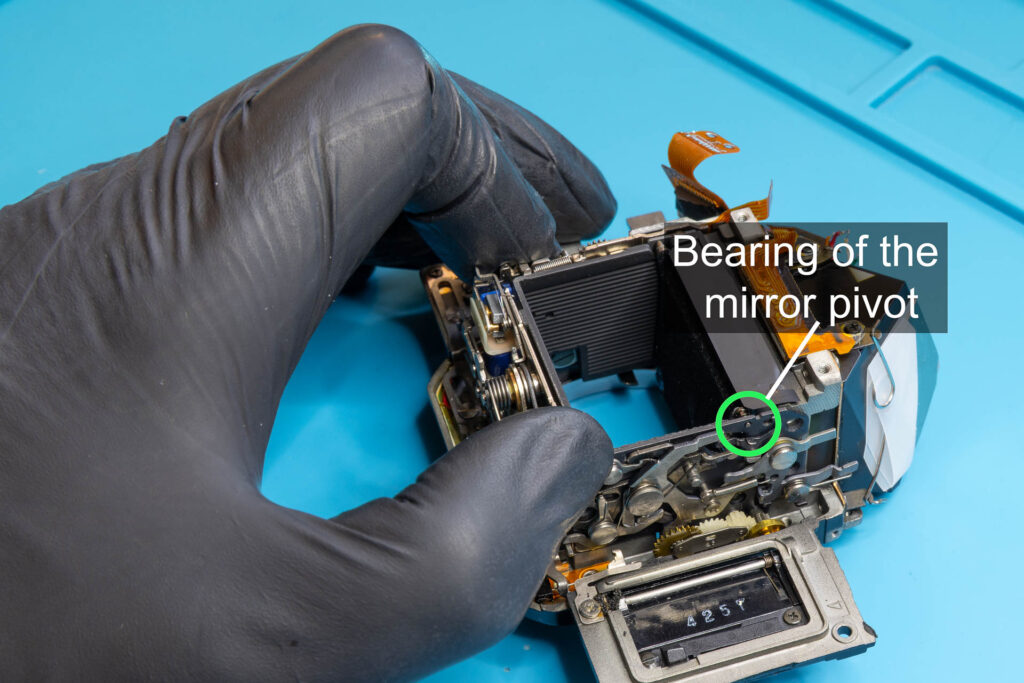 Canon A-1: Install the mirror-control unit on the right side of the mirror box