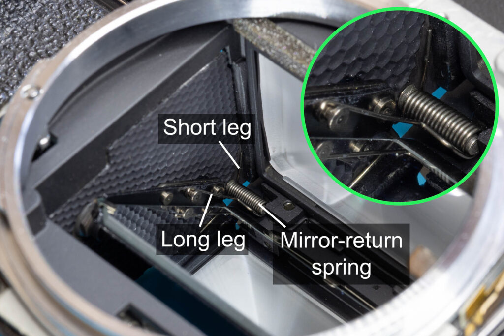 Canon A-1: Correct position of the legs of the mirror-return spring