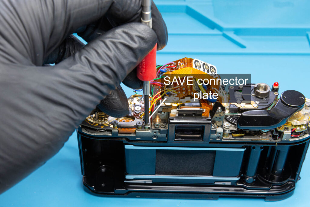 Canon A-1: Close the SAVE connector by installing the SAVE connector plate