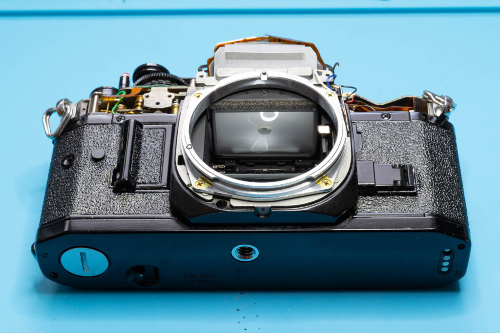 Canon A-1: Apply a bit of black leather grease to the leatherette (Optional)