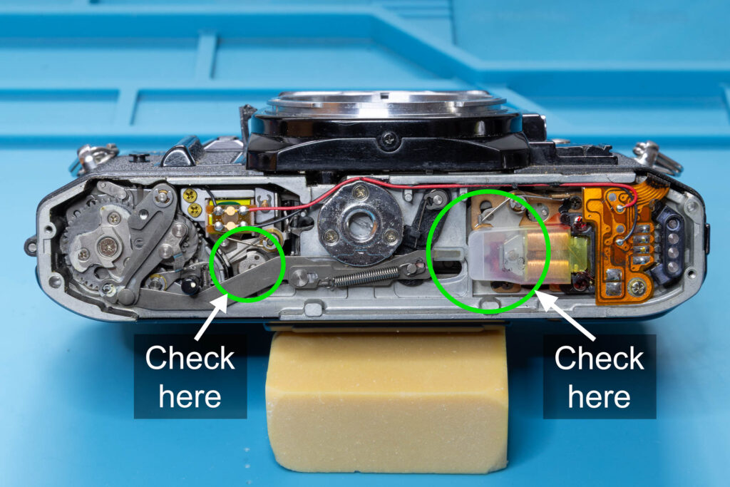Canon A-1: Shutter mechanism on the bottom of the camera when shutter is cocked