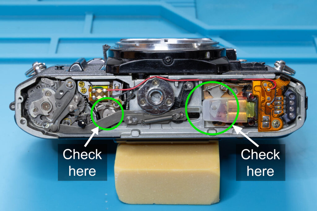 Canon A-1: Shutter mechanism on the bottom of the camera when shutter is not cocked