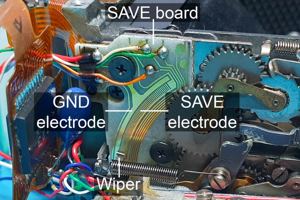 Canon A-1: SAVE (segmented aperture value electrode) board on the side of the mirror box