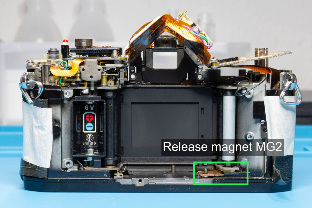 Canon A-1: Underside of release magnet MG2 with armature post on the left