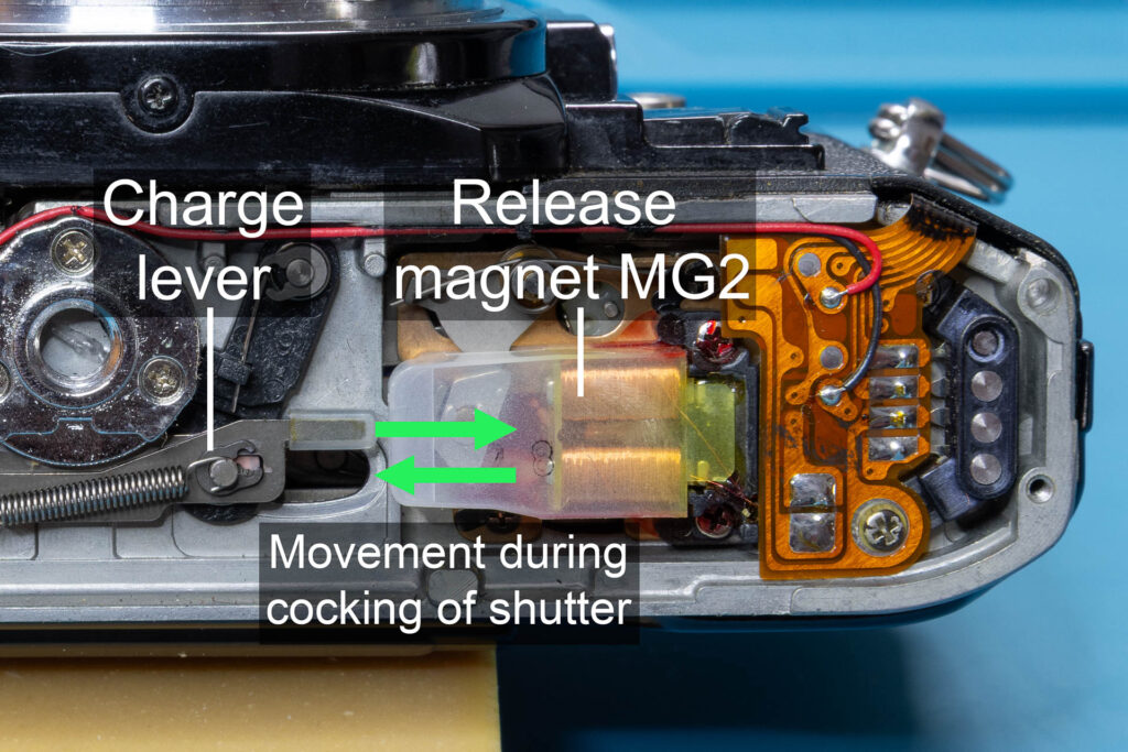 Canon A-1: Cocking of shutter pushes armature against cores of release magnet MG2
